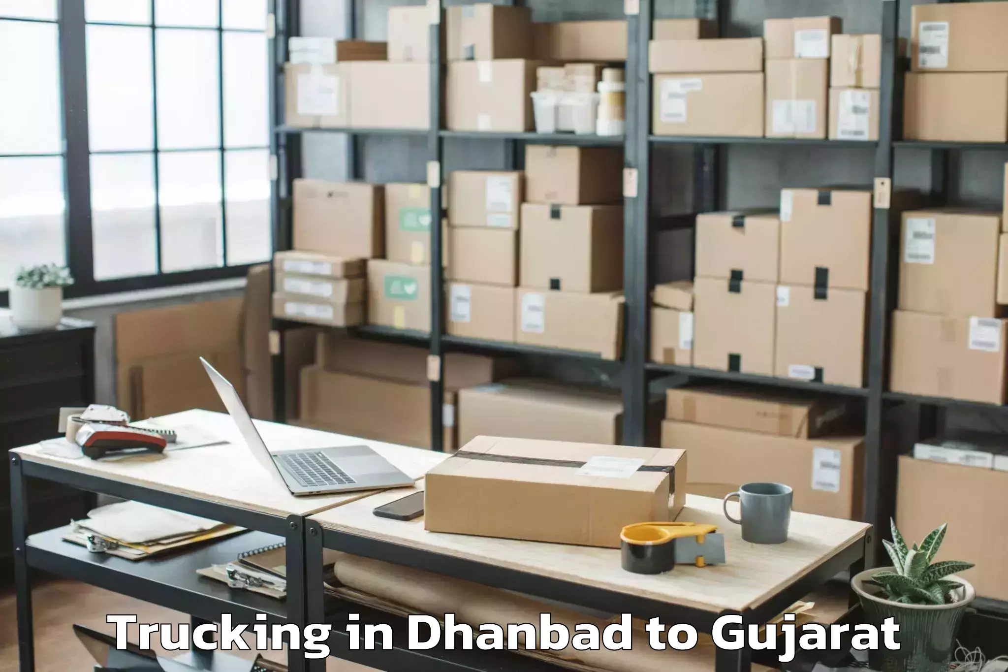 Reliable Dhanbad to Plastindia International Unive Trucking